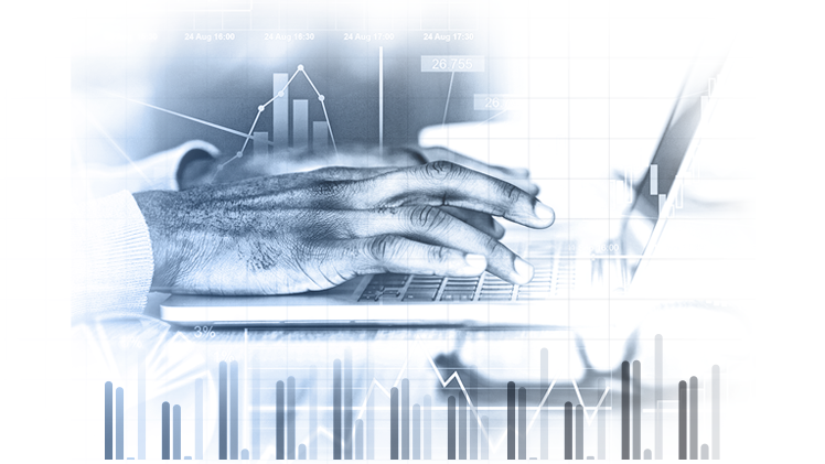 Stylistic image of a hand poised over a keyboard with data charts surrounding it