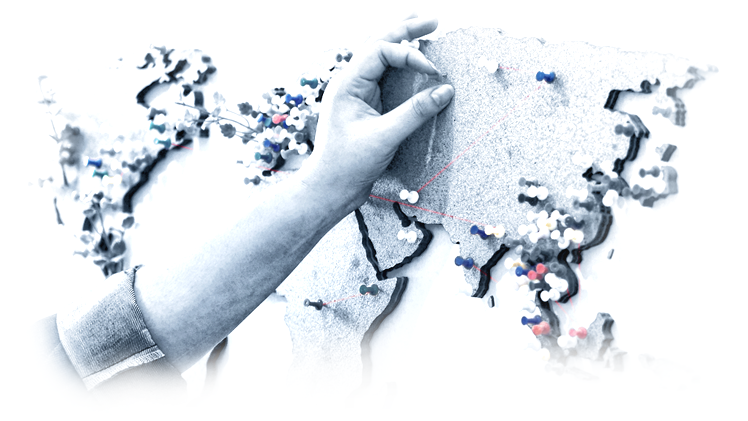 Stylized depiction of a hand putting a pin in a map.